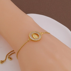 Gold Virgin Mary charm bracelet with sparkling white zircon and adjustable chain link