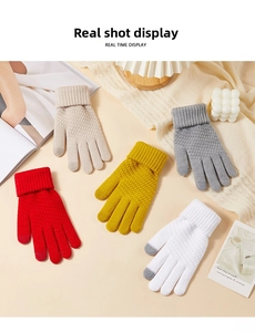 Close-up of knit gloves in red, beige, and yellow with thermal ribbed cuffs and warm texture