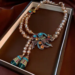 Vintage necklace with colorful rhinestones, champagne beads and elegant tassels