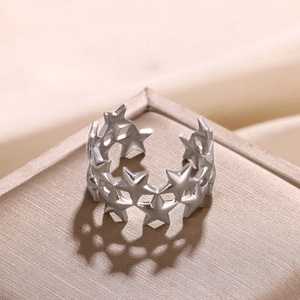 Detailed view of silver star hollow open ring showing delicate geometric cutout patterns