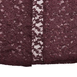 Close-up of wine red lace fabric with intricate floral patterns and mesh texture