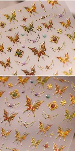 Macro detail of 3D butterfly nail art stickers with embossed gold texture and gems