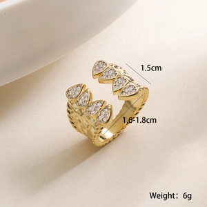 Detailed view of an 18K gold plated ring with teardrop zircon and hammered texture