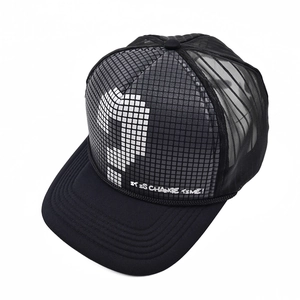 Detail of breathable trucker hat with gray checkered crown and pixelated question mark print