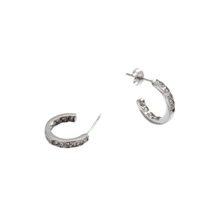 Chic silver C-shaped titanium steel earrings with brilliant pave set crystals on white backdrop