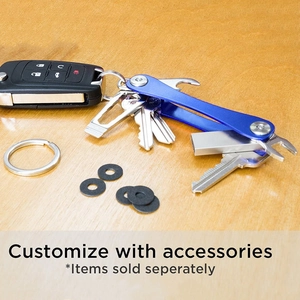 Blue metal key organizer with multitool and washers on a wooden desk setting