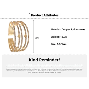 Detailed view of multilayer gold cuff bracelet with rhinestones and heart charms