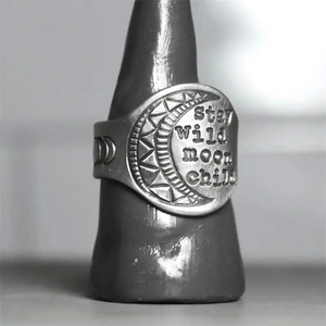 Retro silver crescent moon ring with Stay Wild Moon Child engraving and moon phases