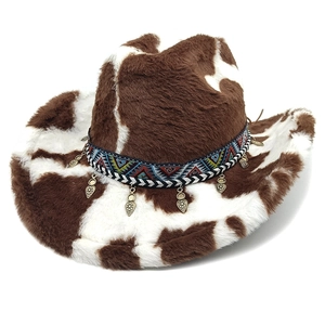 Faux fur cow print cowboy hat with bohemian woven band and metal leaf pendants