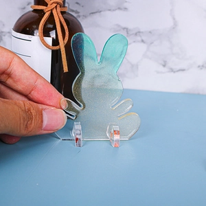 Glittering blue gradient rabbit resin mold ornament with gold flakes and support stand