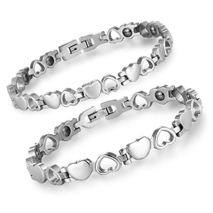 Detail of silver stainless steel heart magnetic therapy bracelets with engraved clasps