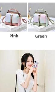 Detail of pink and green gradient PU leather Boston bags with dual zippers and top handles