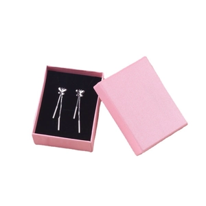 Pink textured gift box with silver butterfly tassel earrings for jewelry packaging