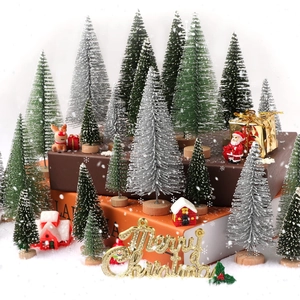 Miniature Christmas tree set with Santa, reindeer and Merry Christmas sign on books
