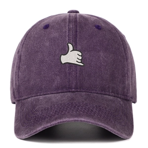Close-up of vintage purple washed baseball cap with embroidered hand gesture patch
