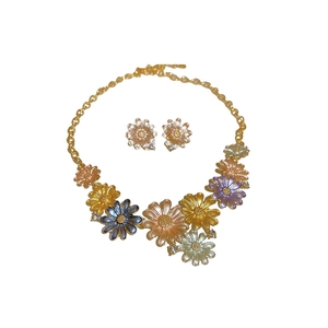 Vintage daisy jewelry set with colorful enamel petals and sparkling crystal accents
