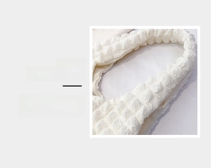 Detail magnification showing comfortable handle and white bubble texture fabric of the bag