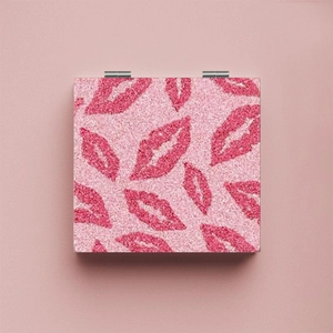 Portable pink glitter folding compact makeup mirror with shiny lip pattern for women
