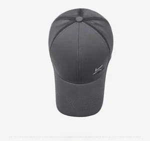 Detail view of dark grey baseball cap showing breathable mesh and metal logo detail