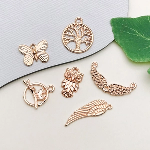 Rose gold vintage zinc alloy charms set including butterfly tree owl and wing pendants