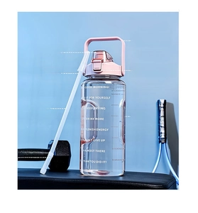 Detailed view of 2000ml sports bottle with safety lock and portable handle on gym bench