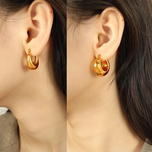 Minimalist 18K gold plated thick cylinder hollow hoop earrings for women shown on ears