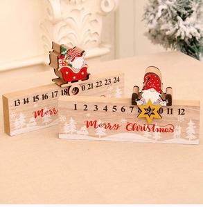 Macro detail of wooden Christmas countdown calendar with sliding Santa indicator