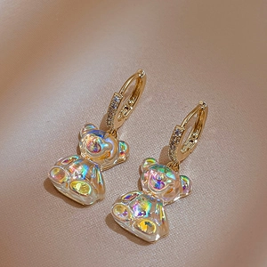 Detail of aurora bear earrings with gold alloy hoops and sparkling cubic zirconia stones