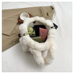 Spacious interior of white plush tote bag showing large capacity for daily essentials