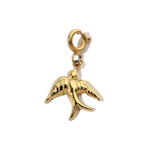 Macro shot of gold bird pendant with a functional spring ring clasp for DIY jewelry