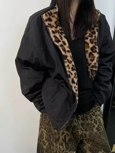 Detail of hooded bomber jacket featuring leopard print faux fur lining and zip closure