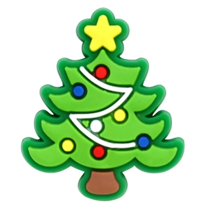 Detailed view of a green Christmas tree PVC shoe charm for DIY clog accessories