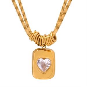 Double-layered gold snake chain necklace with heart pendant and clear gemstone