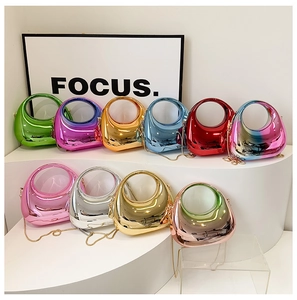 Macro detail of glossy metallic jelly bags with chain straps in multiple vibrant colors