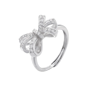 Close-up of silver bow ring with zircon stones and adjustable open band design