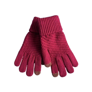 Close-up of pink knit gloves with brown touchscreen tips and ribbed cuffs for warmth