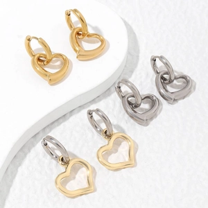 Minimalist hollow heart hoop earrings set in polished gold and silver finishes