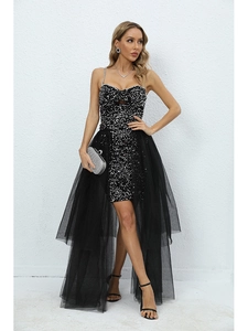 Detail of black sequined dress featuring detachable mesh skirt and spaghetti straps