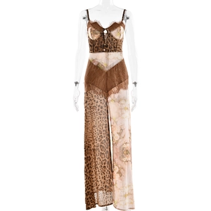 Detail of leopard print jumpsuit with floral lace stitching and wide leg silhouette