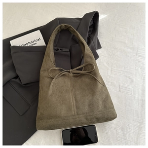 Olive green suede hobo shoulder bag with knot detail and spacious interior for women