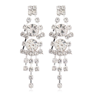 Detailed view of silver bridal tassel earrings with brilliant white crystal rhinestones
