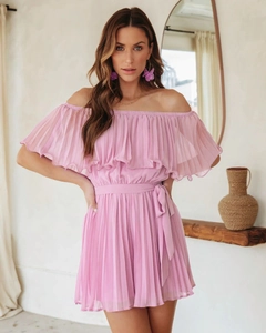 Detail of off-the-shoulder pleated romper in pink with a belted waist and chiffon texture