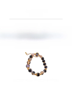 Detail of beaded bracelet with dark gold-veined glass beads and violet spacers
