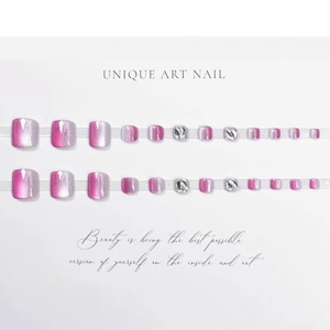 Aurora pink cat-eye press-on toenails with silver textured accents on white background