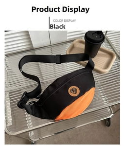 Detail of black and orange oxford cloth waist bag with FS logo on a metal shelf