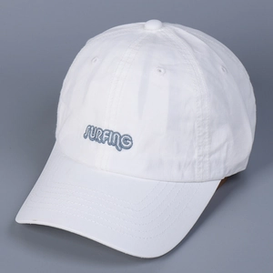 Detail of blue SURFING embroidery on high-quality white washed cotton baseball cap