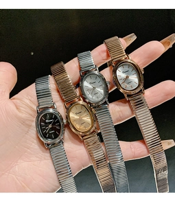 Detail showing four stylish oval quartz watches in silver and gold metal finishes