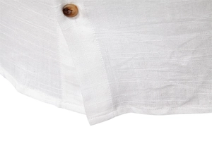 Macro detail of breathable white linen shirt fabric with a natural wood grain button