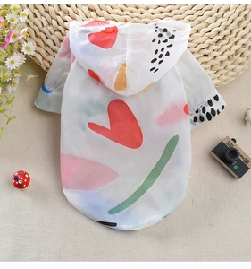 Detail view of thin breathable pet hoodie with colorful heart prints and elastic cuffs