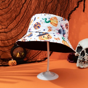 Reversible Halloween bucket hat with pumpkin and bat prints on an orange background
